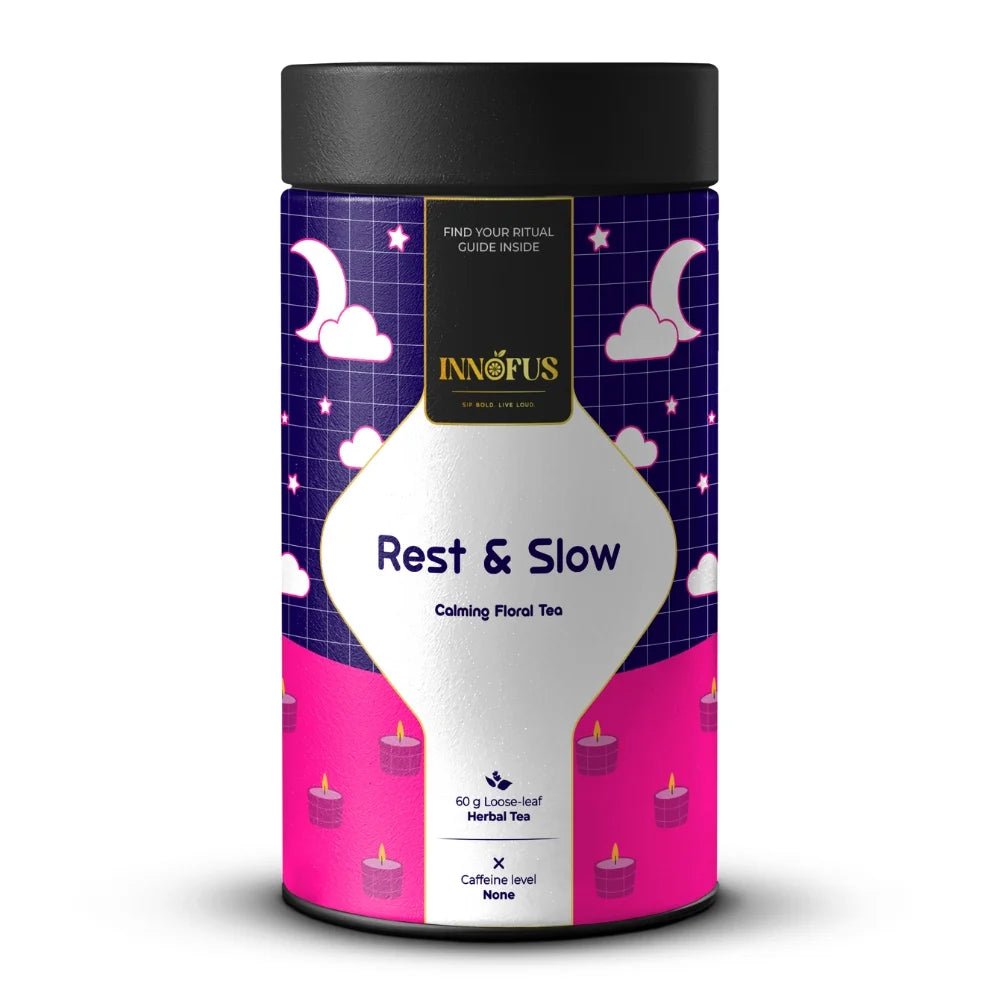 Rest & Slow nighttime calming floral tea by Innofus; blue pea, lavender, chamomile in caffeine-free loose leaf blend, moon/cloud label, front and back nutrition info.