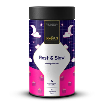 Rest & Slow nighttime calming floral tea by Innofus; blue pea, lavender, chamomile in caffeine-free loose leaf blend, moon/cloud label, front and back nutrition info.