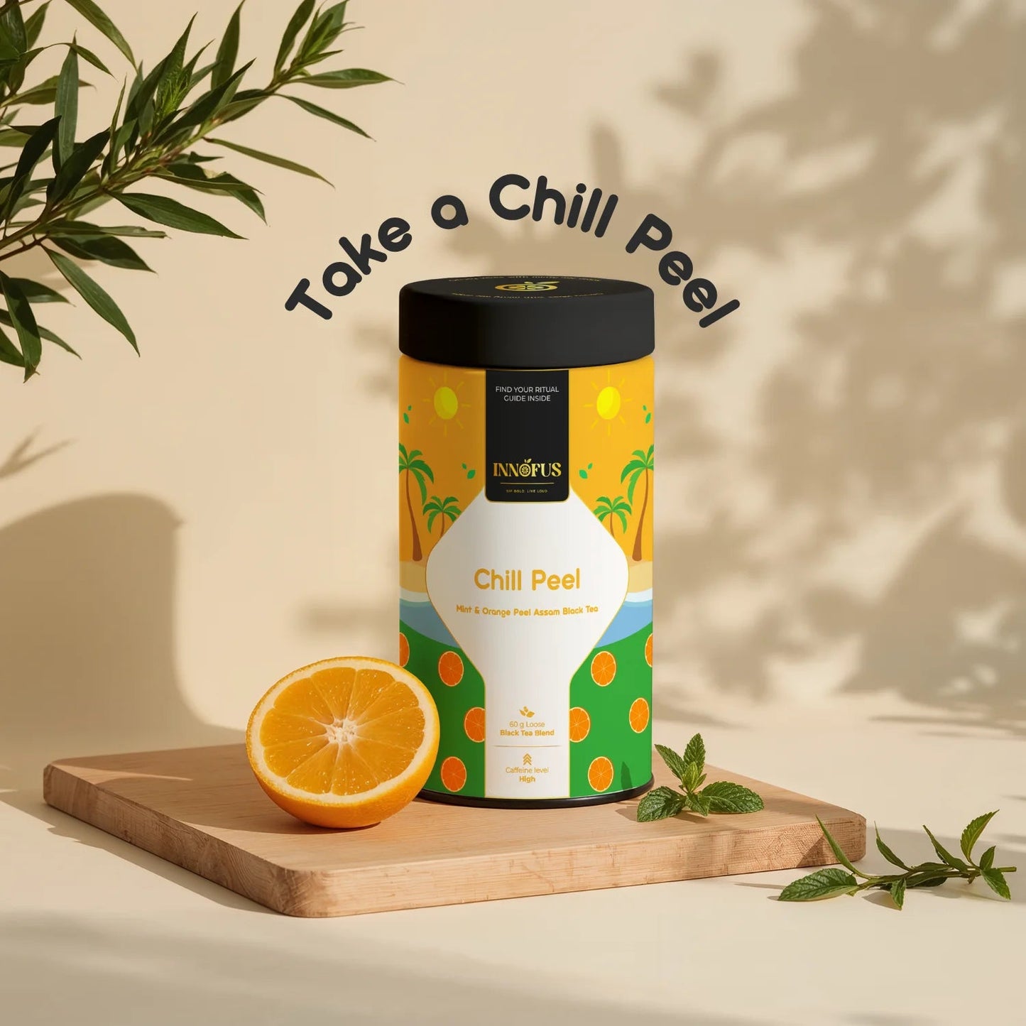 Chill Peel by Innofus, mint orange Assam black tea tin with half orange and mint leaves on wooden board, “Take a Chill Peel” text, beige background, citrus wellness tea.