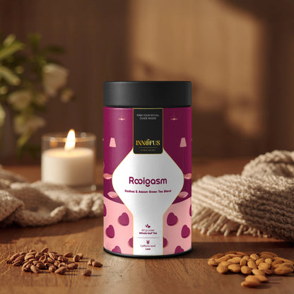 Rooigasm tea blend by Innofus in airtight tin, rooibos and Assam green tea, almonds, cocoa nibs, marigold, relaxing herbal loose leaf, candle and cozy setting